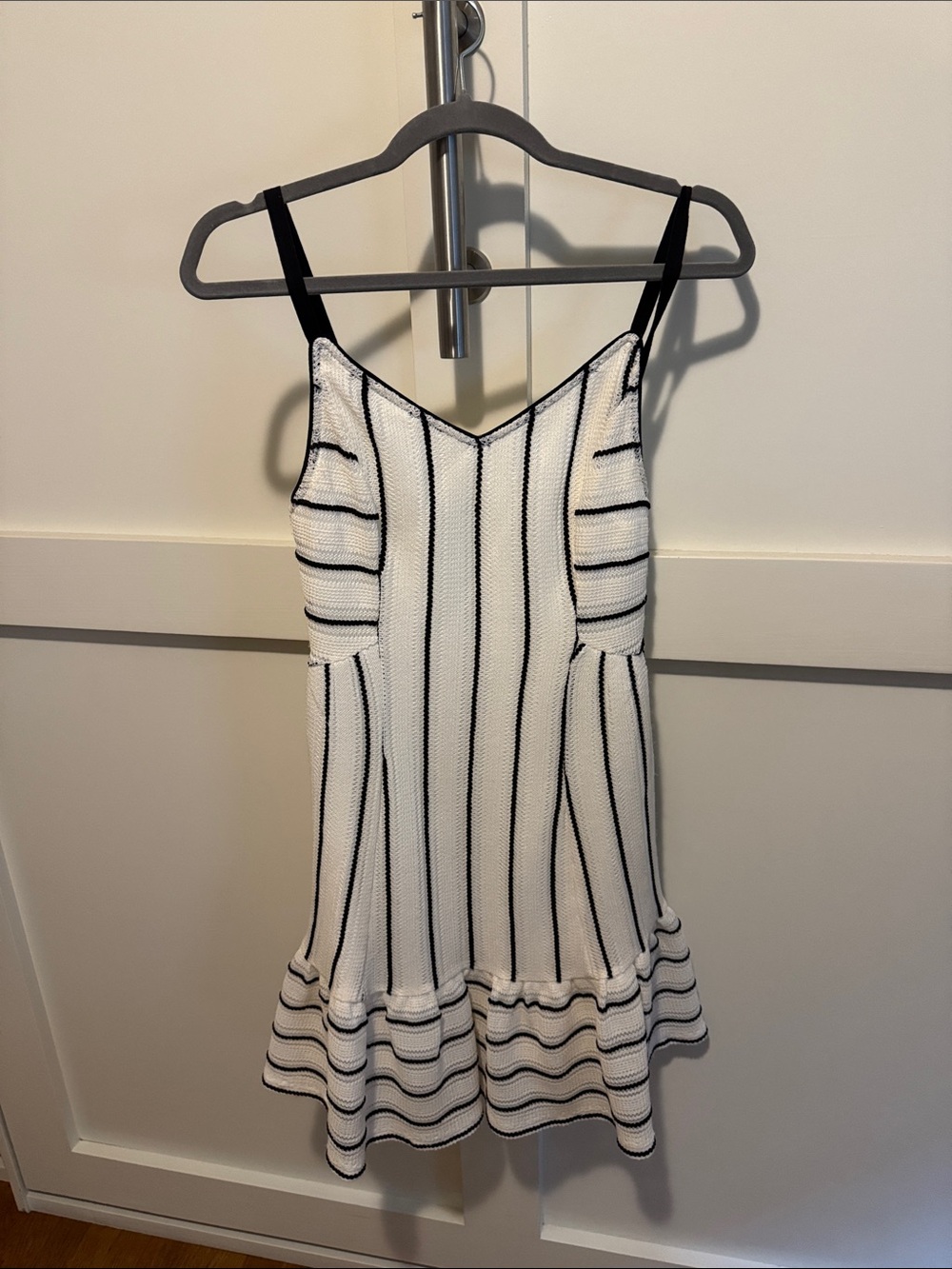 Sleeveless White Mini Dress with Black Stripes